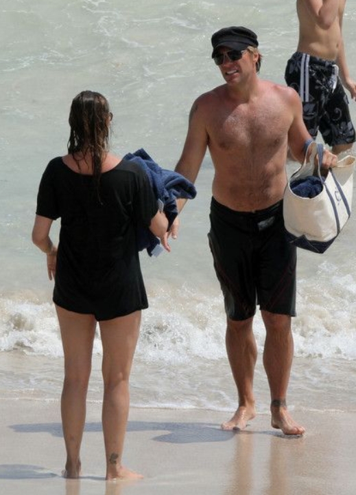 Rock Legend Spotted on a Beach Getaway with Mystery Woman: Who Is He?