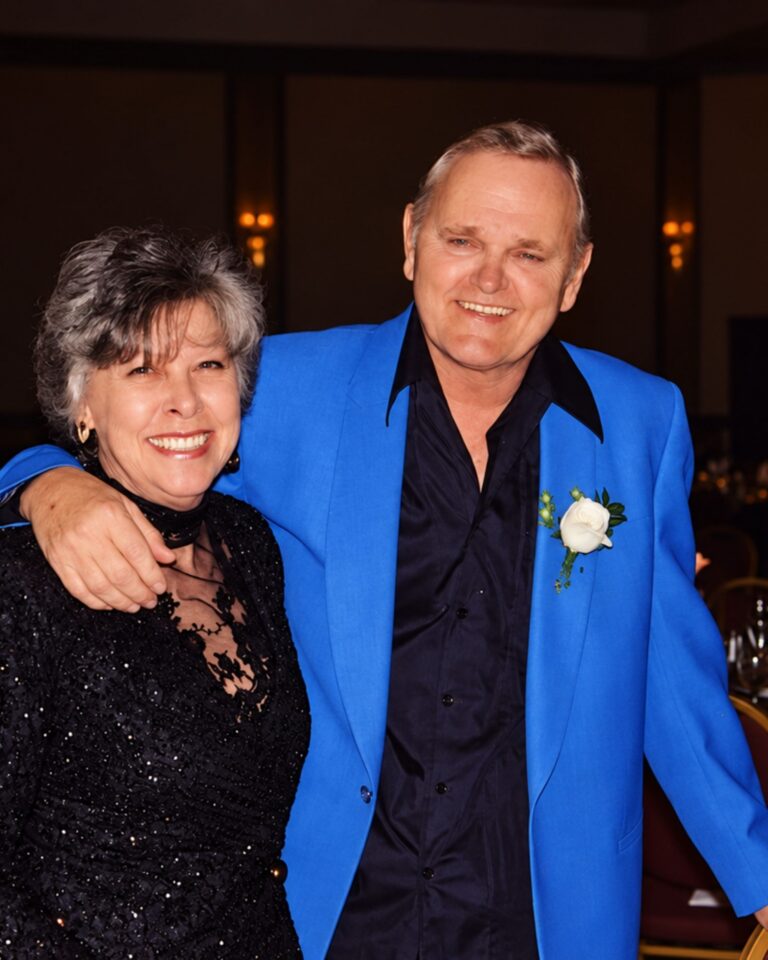 When Jerry Reed brought his young family to Nashville, the reliable singing income did not yet come from him. It came from his wife, Priscilla Mitchell. They had married in 1959, shortly after Priscilla graduated from high school and while Jerry was serving in the Army. Their first daughter, Seidina, was born the following year. Jerry had already recorded for Capitol and written songs that other performers could use, but the label had dropped him when he entered military service. Talent had opened a few doors. It had not yet provided the family with a dependable life. After the Army, Jerry returned to the uncertain work available to a gifted musician without a secure career. He played sessions, placed songs where he could and continued developing the unorthodox guitar style that Chet Atkins recognized long before the public did. Some of his compositions reached radio through other voices. His own records remained another matter. Priscilla went into Nashville’s studios. She had sung professionally in Georgia before the marriage and knew how to shape a harmony around another performer. Background singing rarely placed her name on the label, but it produced paying work. Jerry later acknowledged that Priscilla’s studio singing kept the Reeds going during those early Nashville years. Then, in 1965, the wife working quietly behind other singers stepped forward on a record of her own. Mercury paired Priscilla with Roy Drusky for “Yes, Mr. Peters,” an unusually constructed cheating song presented as a telephone conversation. Priscilla played the woman calling her married lover. Drusky disguised his answers so that anyone nearby would believe he was discussing business with a man named Mr. Peters. The performance depended on Priscilla sounding intimate without becoming theatrical. Her calm delivery allowed the two conversations—one genuine, one invented—to exist at the same time. Country audiences understood it immediately. “Yes, Mr. Peters” reached No. 1 and remained there for two weeks. At that point, Priscilla Mitchell had achieved a chart position Jerry Reed had spent years pursuing. He had been signed to RCA by Chet Atkins, but his first album for the label would not arrive until 1967. “Guitar Man,” the Elvis Presley sessions, “Amos Moses,” “When You’re Hot, You’re Hot” and Smokey and the Bandit still lay ahead. Priscilla continued recording with Drusky and released solo material, but her public career gradually narrowed as Jerry’s expanded. Their second daughter, Lottie, arrived in 1970, just as his records began turning him into one of country music’s most recognizable personalities. In later years, Priscilla rejoined him professionally, singing background vocals and playing keyboards on the road. Their marriage lasted forty-nine years, ending only with Jerry’s death in 2008. By then, his fame had grown large enough to rearrange the family history around him. Priscilla was increasingly remembered as Jerry Reed’s wife, while her own No. 1 record became a line buried inside his biography. The chronology tells a less convenient story. Before Nashville made Jerry the name worth remembering, Priscilla Mitchell had already reached the top of the country chart—and he was still trying to find his way there.